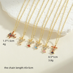 Gold plated animal pendant necklace with rabbit and elephant designs and zircon stones