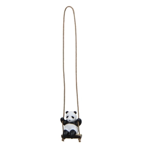 Detail of creative resin panda swinging on a wooden seat with brown hanging rope