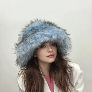 Close-up of fluffy light blue faux fur hat showing thick plush texture and luxury style