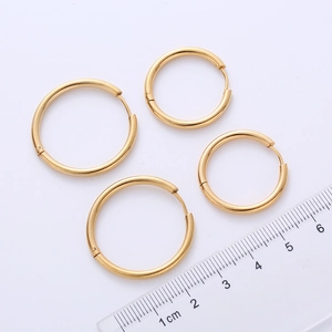 Set of minimalist 2.5mm gold hoop earrings in various sizes with a measuring ruler