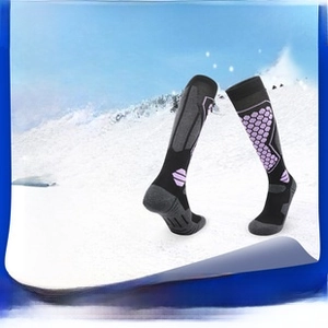Detail view of colorful merino wool ski socks with thickened texture for thermal warmth