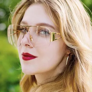 Fashionable square gold metal aviator sunglasses with diamond accents on woman model