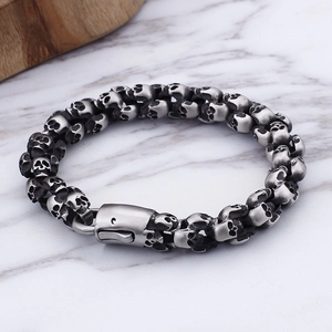 Vintage stainless steel skull link bracelet for men with retro silver finish and metal clasp