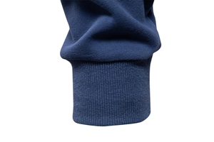 Detail showing the elastic ribbed cuffs and high-quality navy blue knit fabric of the polo hoodie