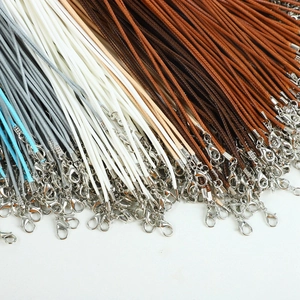 Close-up of assorted colorful wax cords with metal lobster clasps for necklaces