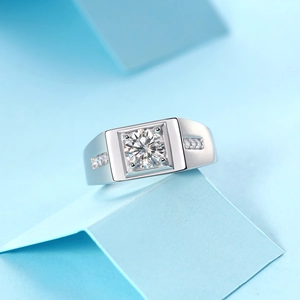Macro shot of 925 silver ring featuring a large round moissanite center stone on blue blocks