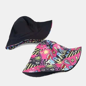 Reversible bucket hat with vintage graffiti print and solid black canvas for sun protection