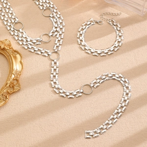 Detail view of silver multi-layer body chain and bracelet with circular metal rings