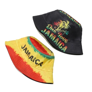 Detail of two Jamaican reggae style bucket hats featuring One Love prints on white background