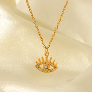 Detail of 18K gold stainless steel evil eye pendant with sparkling cubic zirconia