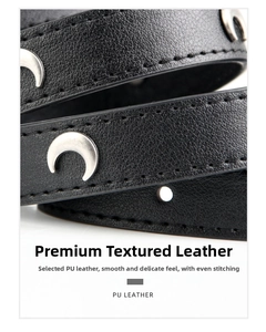 Close-up of black PU leather belt with silver crescent rivets and fine textured grain