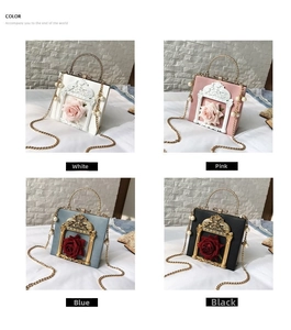 Detailed relief frame design with 3D rose and pearl handle on elegant handbags