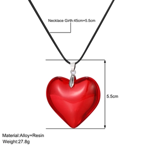 Detail showing red resin heart pendant dimensions with measurement labels on white background