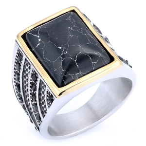 Macro detail of men's Masonic ring with black gemstone and silver gold-tone finish