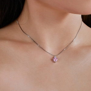 S925 sterling silver necklace featuring a heart-shaped pink gemstone and clear accent stone
