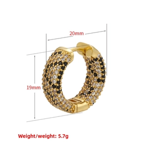 Detail view of 20mm gold hoop earrings with leopard print micro-pave cubic zirconia