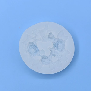 Blue circular silicone mold with detailed rose flower and leaf patterns for DIY baking