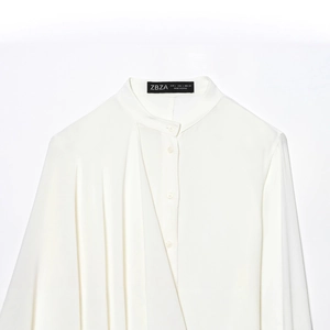 Women's minimalist white crew neck long sleeve blouse with asymmetric pleated design