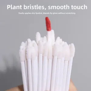 Macro detail of soft plant fiber lip brush showing smooth application with red lipstick