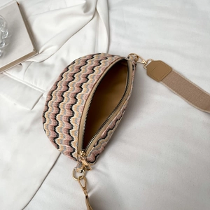 Fashionable wave pattern knit crossbody bag with beige strap and golden hardware