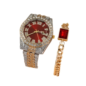 Elegant women's gold and silver watch set with red dial, crystals, and matching bracelet