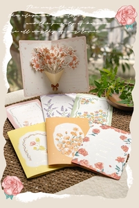 Detail showing 3D pop-up lily flower bouquet card and hand-painted floral greeting cards
