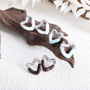 Irregular heart enamel earrings in white, blue, and brown with silver finish tassels