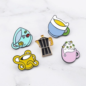 Cartoon enamel pins set featuring colorful coffee cups and mocha pot on marble surface