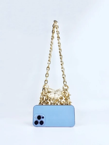Detail of hollow acrylic woven bucket bag with phone for size comparison reference