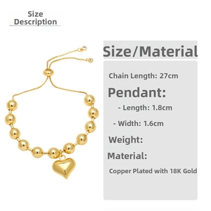Detailed view of 18K gold plated bead bracelet with adjustable slider and heart charm