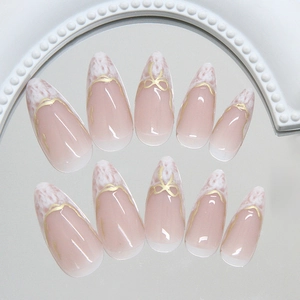 French press on nails featuring pink blush gradient and delicate gold line accents