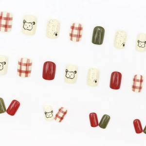 Short square press-on nails set featuring red checkerboard and cartoon sheep designs