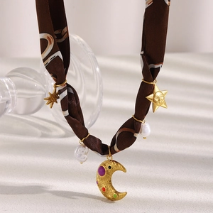 Retro 18K gold plated necklace featuring crescent moon and star charms with silk scarf band
