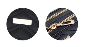 Close-up of black leather wallet featuring gold metal plate and V-shape quilted texture