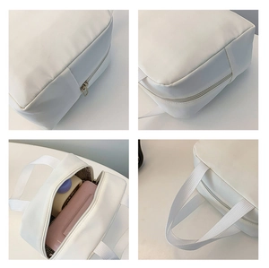 Detailed views of white insulated lunch bag with zipper and sturdy handle