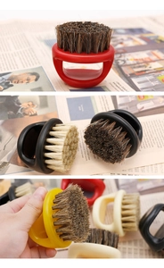 Detail of round ring handle beard brushes with natural bristles in multiple colors