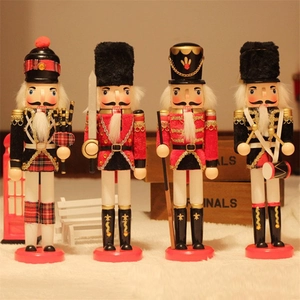 Detail of four 30cm wooden nutcracker dolls including soldiers with swords and drums