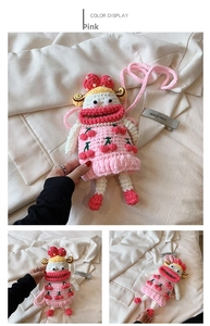 Detailed view of pink hand-crocheted bag with cherry 3D pattern and pearl chain strap