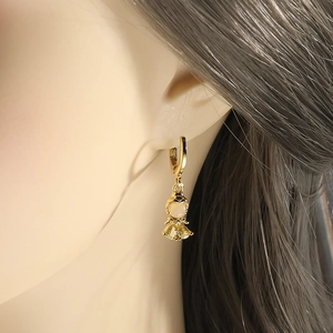 Sparkling cartoon girl drop earrings with yellow zircon crystals and gold finish