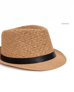 Detail of hand-woven straw fedora with a black leather band and wide brim texture