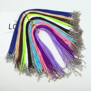 Colorful braided necklace cords with metal lobster clasps and extension chains detail