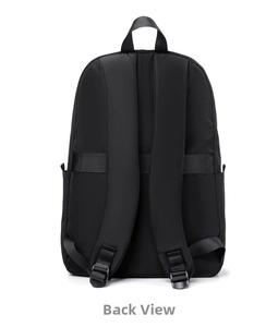 Detail view of the backpack back showing wide shoulder straps and luggage sleeve