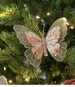 Detail of pink feather butterfly ornament with sequins and pearls on a Christmas tree