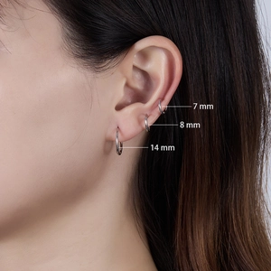 Three sizes of 925 sterling silver hoop earrings shown on model with 7mm 8mm 14mm labels