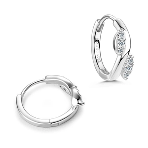 Detailed macro view of S925 sterling silver leaf earrings with engraved hallmarks