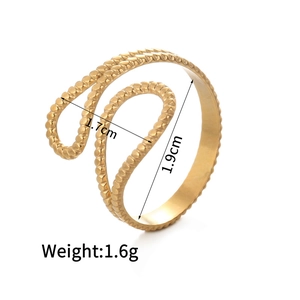 Macro detail showing 14K gold C-shaped ring dimensions with bead and rope texture