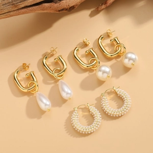 Three pairs of vintage pearl hoop earrings in 18K gold plating with varied drop shapes