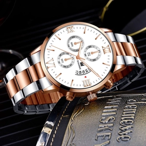 Close-up of luxury men's business watch with Roman numerals and three functional sub-dials