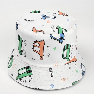 Close-up of white cotton bucket hat with colorful cartoon dinosaur and car pattern