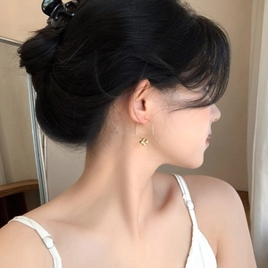 Elegant gold clover charm hook earrings for women featuring a minimalist polished finish